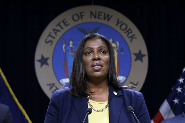 A 2019 photo of New York State Attorney General Letitia James standing at a podium in front of the New York state seal.